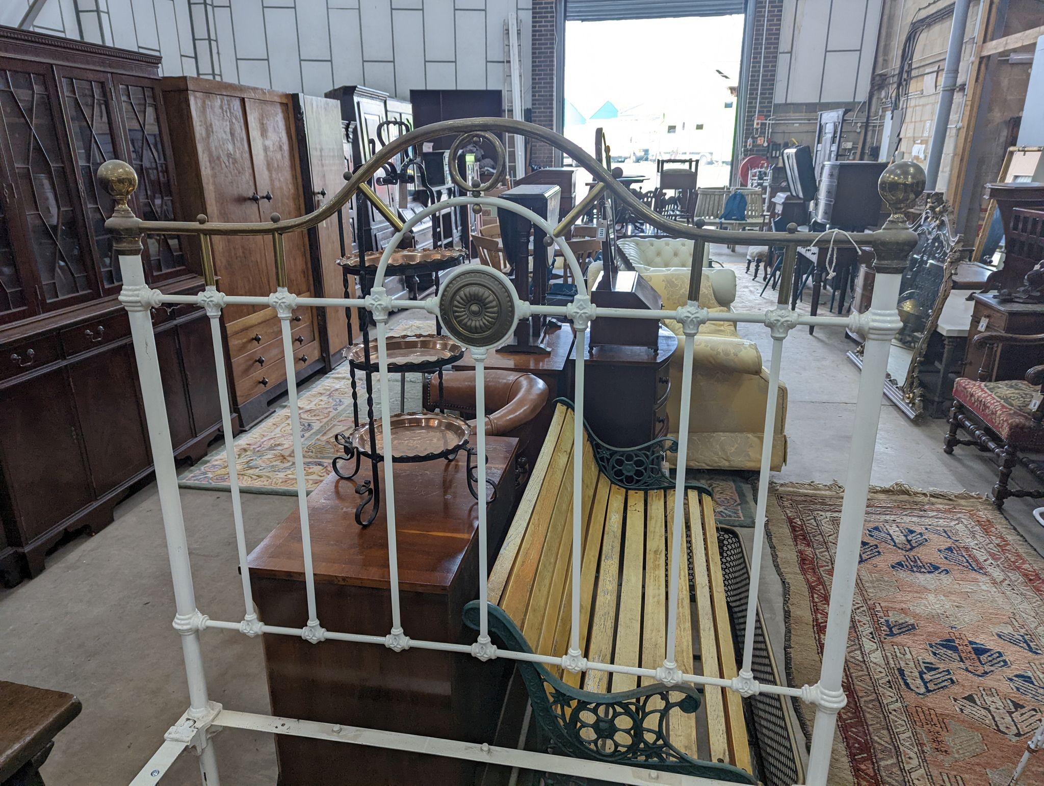 A Victorian painted iron and brass single bedframe, width 120cm, length 200cm